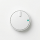Thermostat with green indicator on white background — energy optimization with people counting