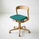 Empty office chair with teal seat — symbolizing no-show detection with BLDNG sensors in hot desking